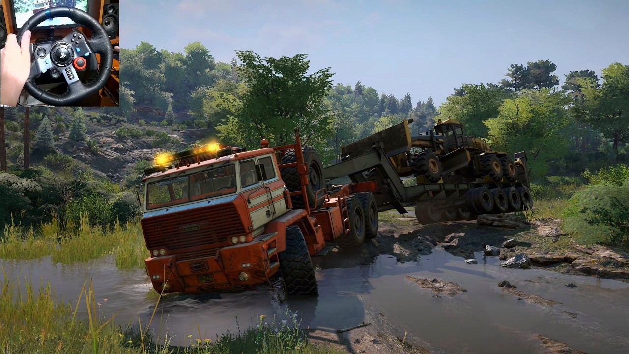 Sleiter Chimera Hauling a Road Grader Through Deep Mud