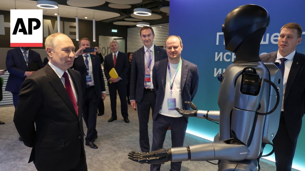 Putin greeted by dancing robot as he arrives at AI conference in Russia