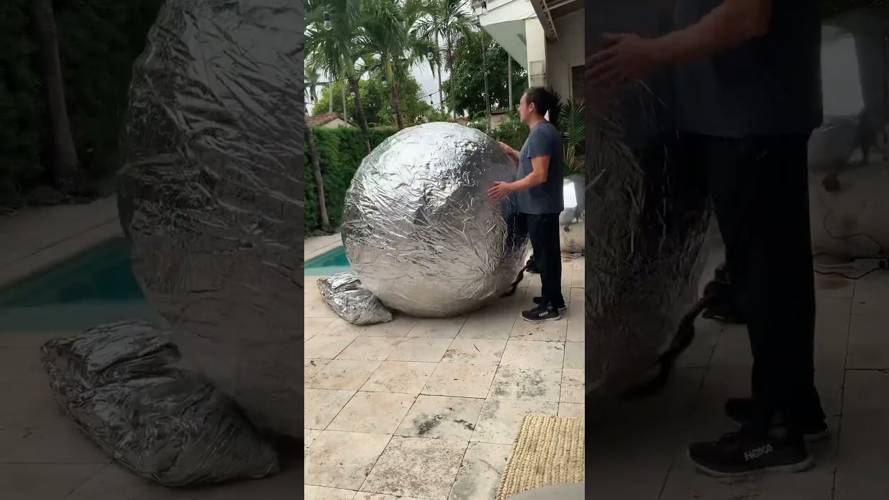 Inflatable Artistry: The Viral Silver Sphere Everyone&rsquo;s Watching 🌟⚪ #ArtInnovation #ViralMoment