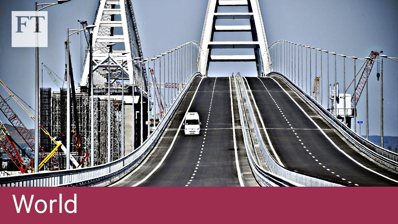 Vladimir Putin drives across new bridge to Crimea