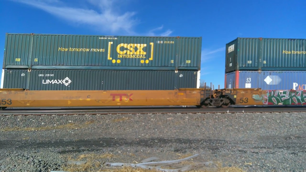 UP 7964 leading z-train with autoracks west of Gibbon