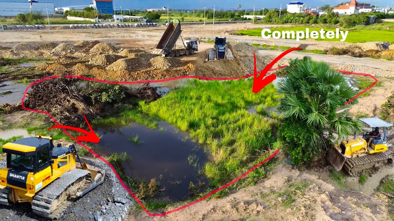 Completely Filling Rock Reclaim a Shallow Pond Using SHANTUI DH17c3 Dozer Moving Smoothly