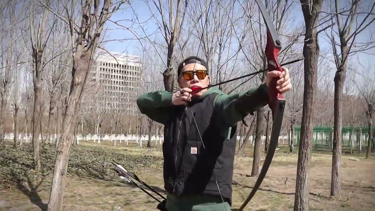 Black hunter Hunting Longbow outdoor archery demonstration