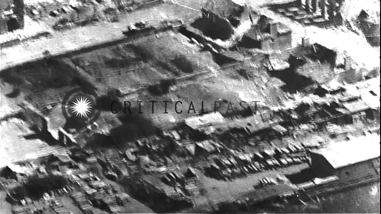 Aerial views of damage from U.S. Army 155 mm Long Tom guns firing upon Mortain, F...HD Stock Footage