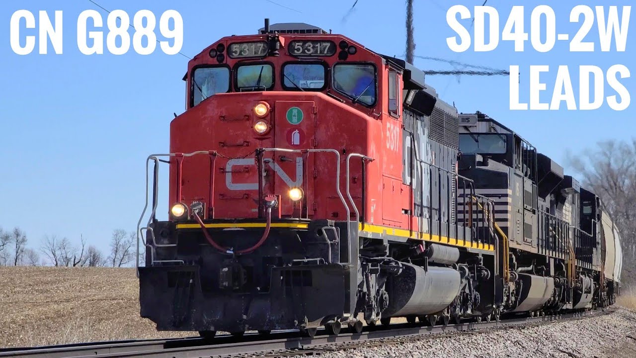 Wide cab SD40-2W leads Canadian National G889 through Rockford and Seward 2022-03-12