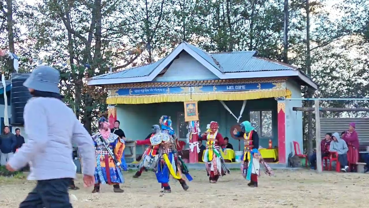 The Monpa community has its own traditional wood mask dance....