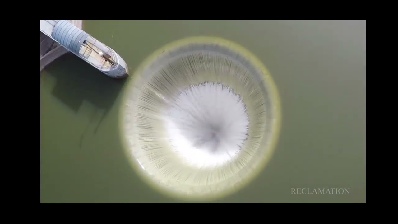 How do dams release water?