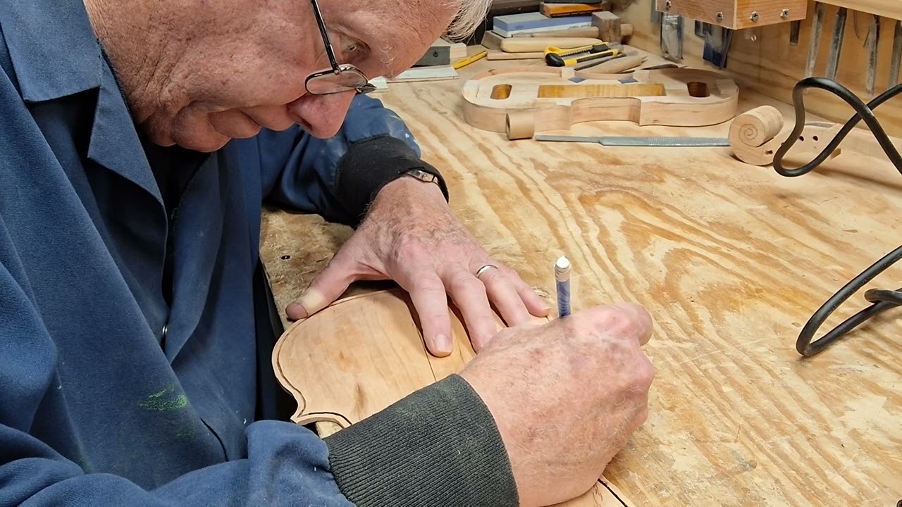 Cutting the purfling slot on the cherry back. 