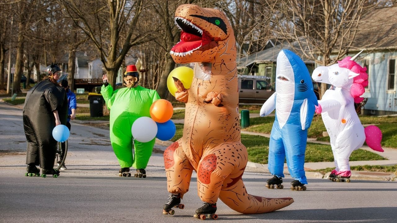 Rollerskating as T-Rex and unicorn to bring cheer to those separated due to coronavirus pandemic