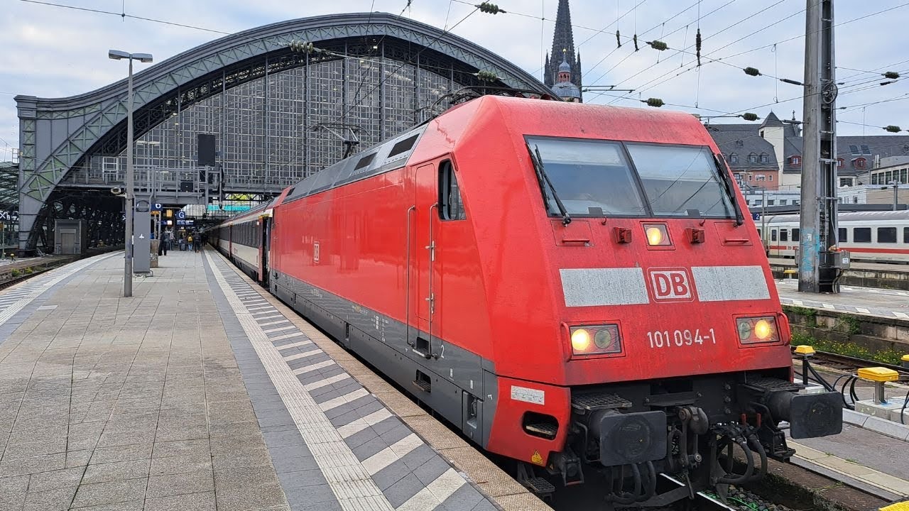 Germany: At Koln Hbf, a DB Class 101 electric loco departs on train EC7 0421 Hamburg Altona - Basel