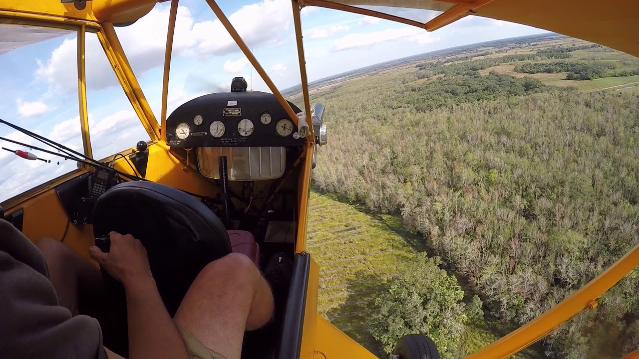GoPro - Piper J3 Cub Landing on Dirt Road to Hit a Fishing Hole