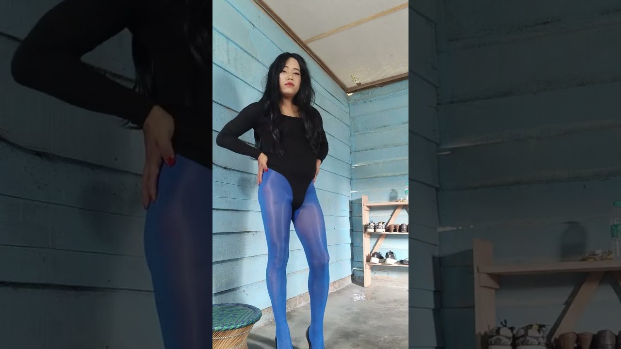 Crossdresser in blue shiny tights 
