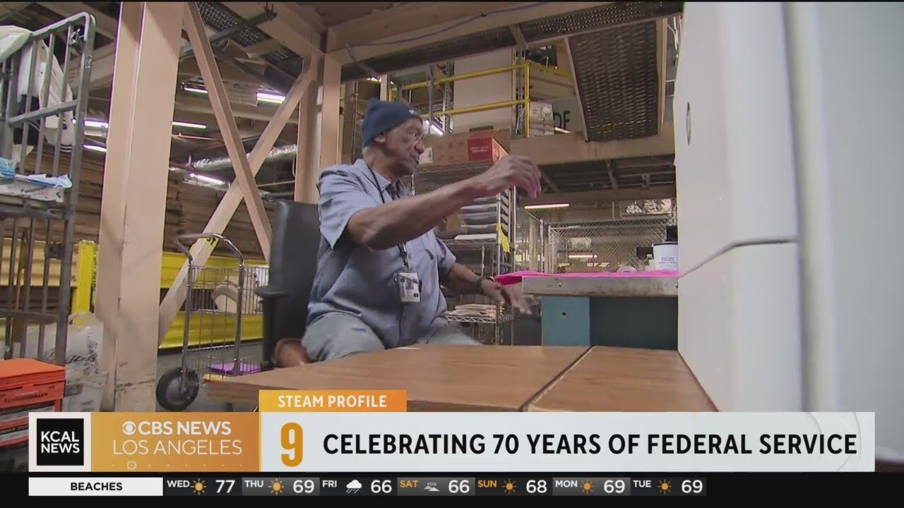 Leroy Brown, a US Postal Service clerk, welcomes the technology used at the distribution center