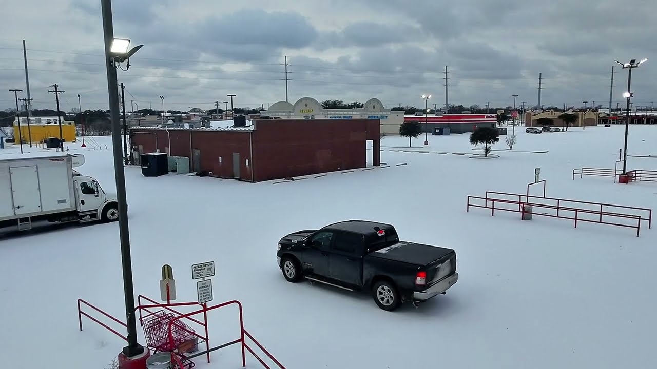 FlyerCam over Garland Tx Hiep Thai market drone winter ice snow Jan 2026