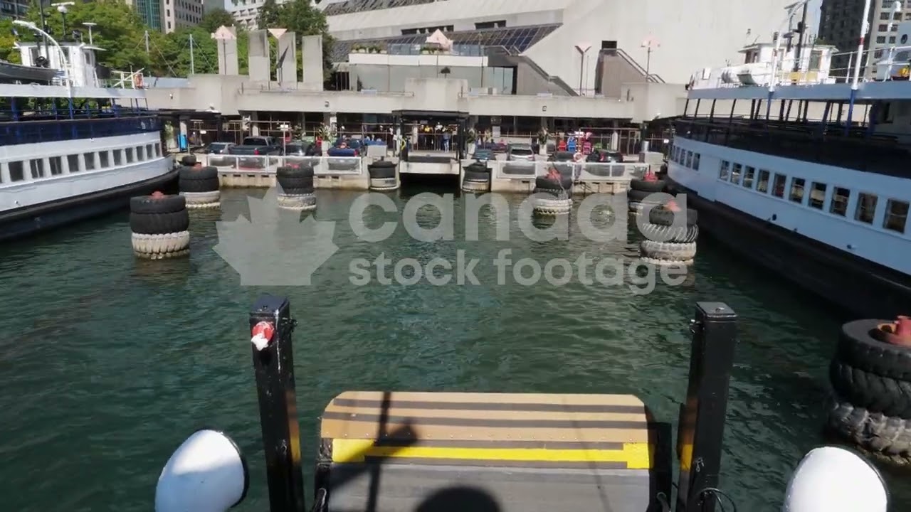 Passenger view ferry arriving at Jack Layton terminal stock video. Toronto, Canada. 4K stock video.