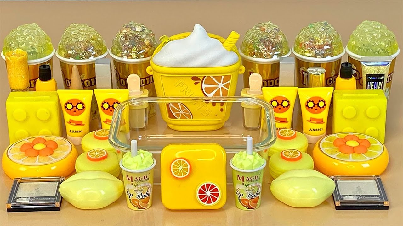 YELLOW SLIME. Mixing makeup and glitter into Clear Slime. ASMR Satisfying Slime Videos 1080p.