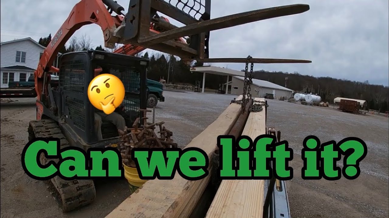 Kubota SVL 90-2 getting it done - offloading lowboy trailer at the lot