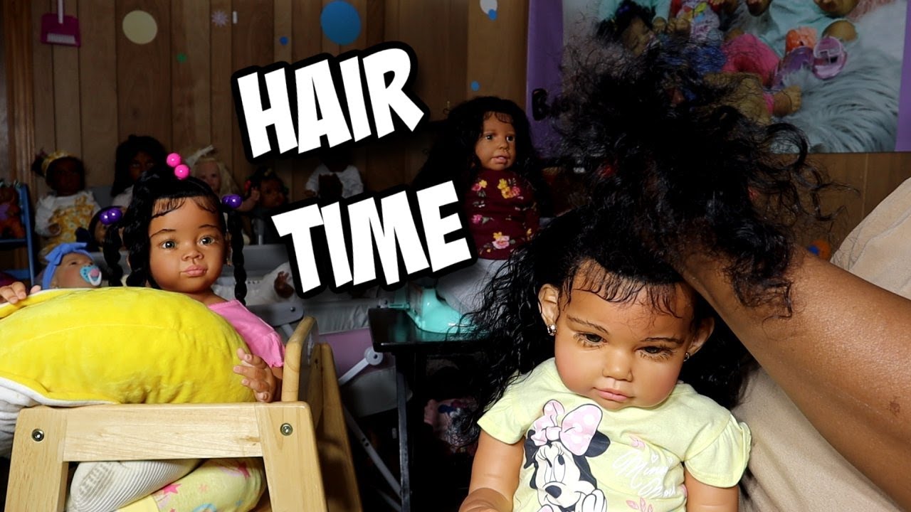 Reborn toddler Ella Mae is getting her hair done in ponytails
