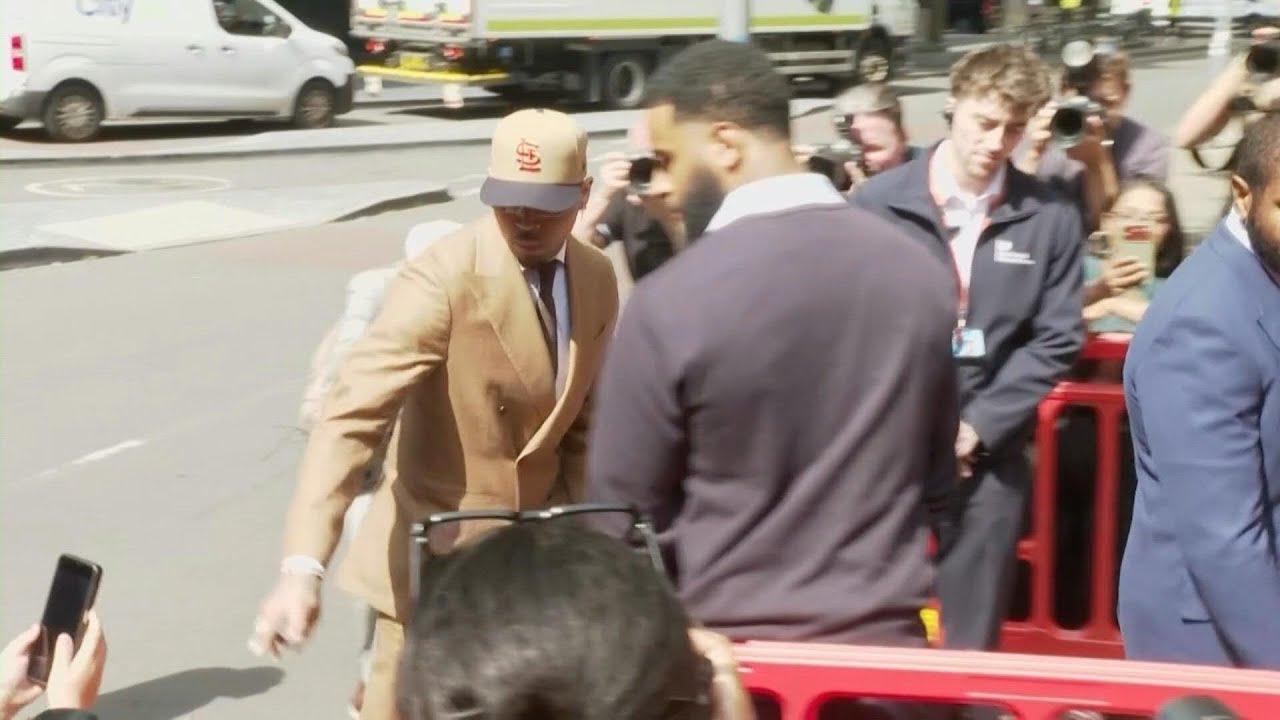 US singer Chris Brown arrives at a London court for assualt case hearing | AFP