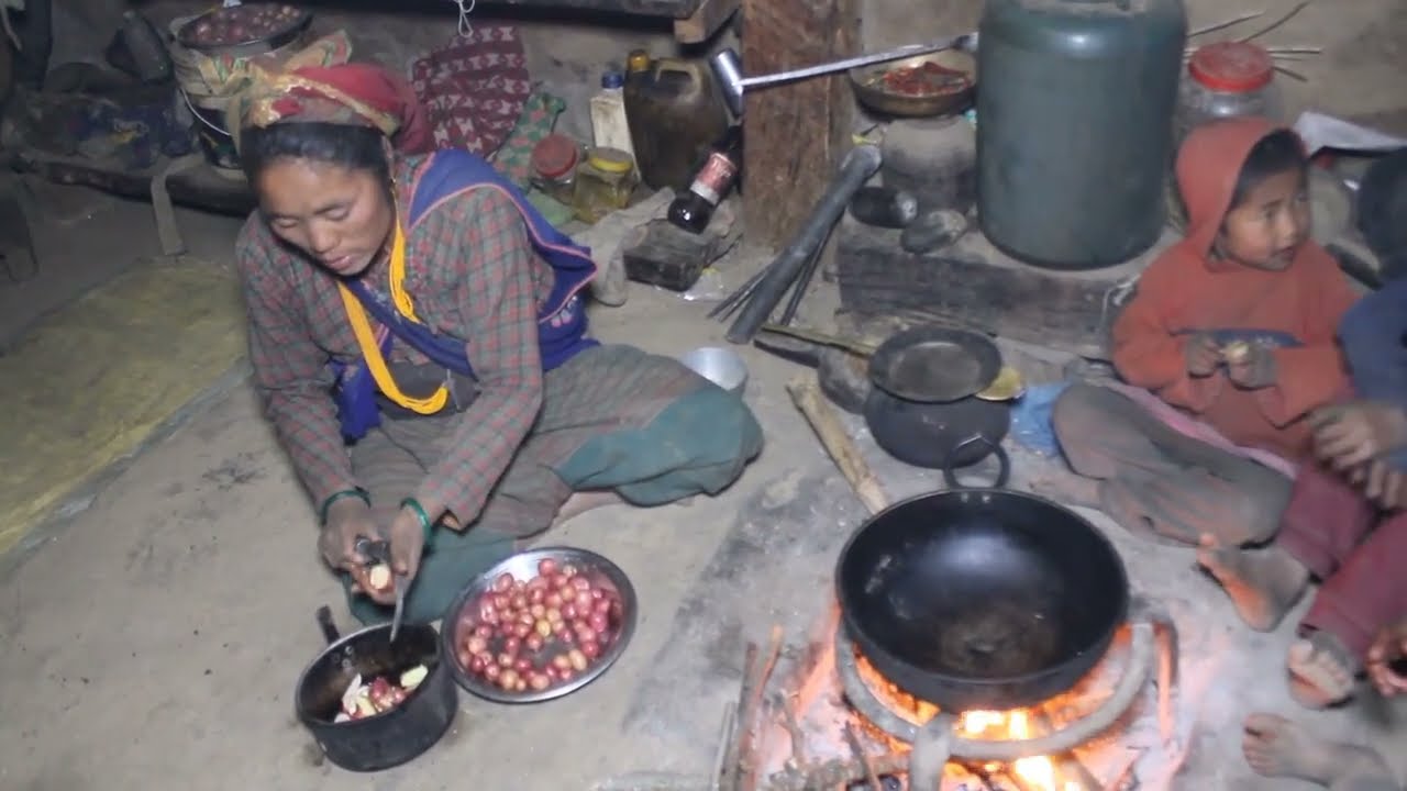 Cooking potatoes and Gundruk vegetables in the village