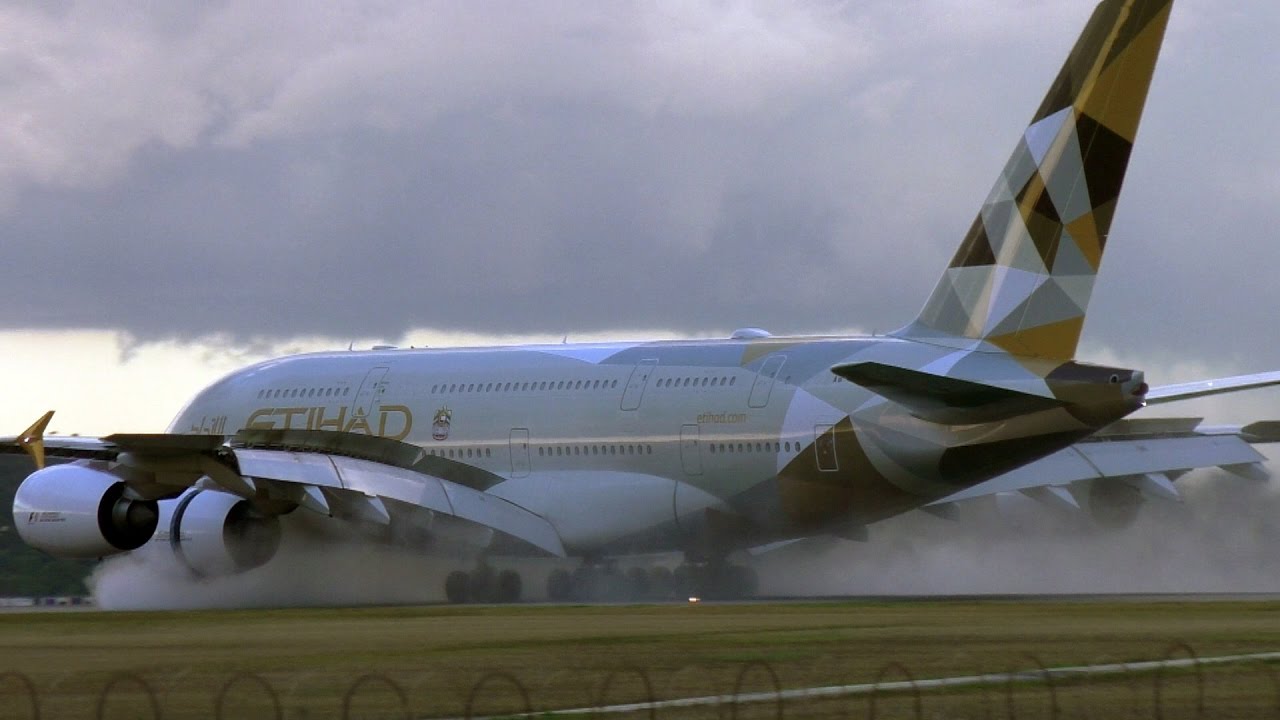 A380 Reverse Thrust and huge water backwash on a wet Melbourne Airport Runway