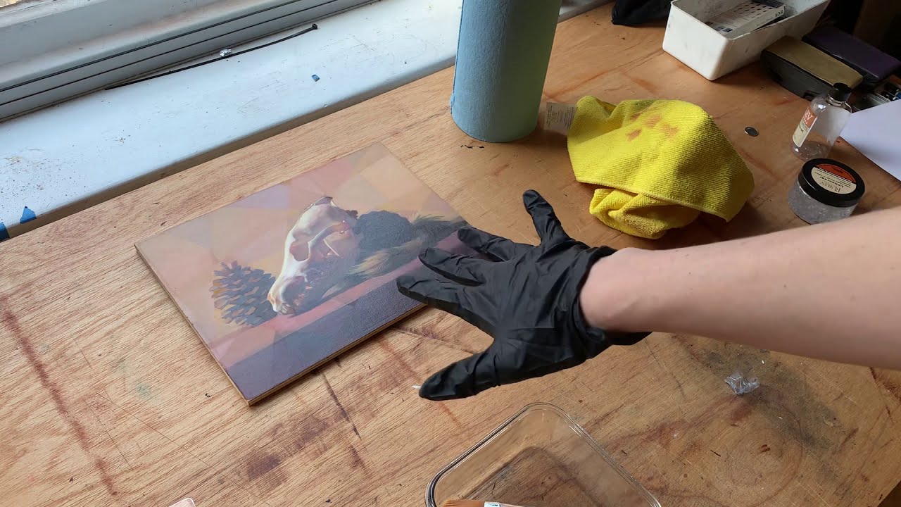 Varnishing an oil painting with Conservar