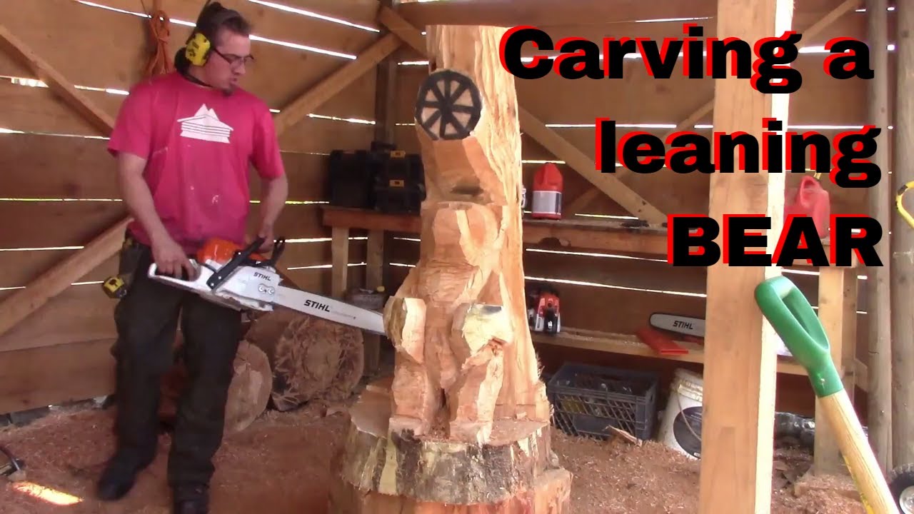 Carving a bear leaning on a tree