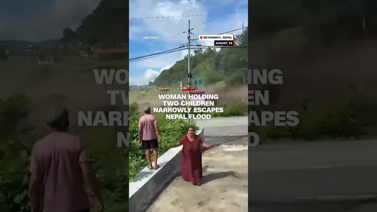 Woman holding two children narrowly escapes Nepal flood