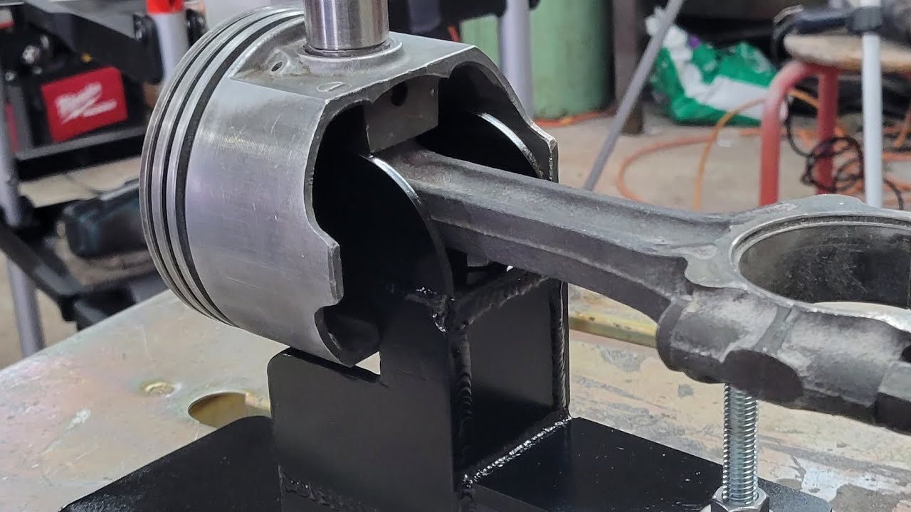 Wrist pin removal from forged pistons and stock rods with homemade tool.