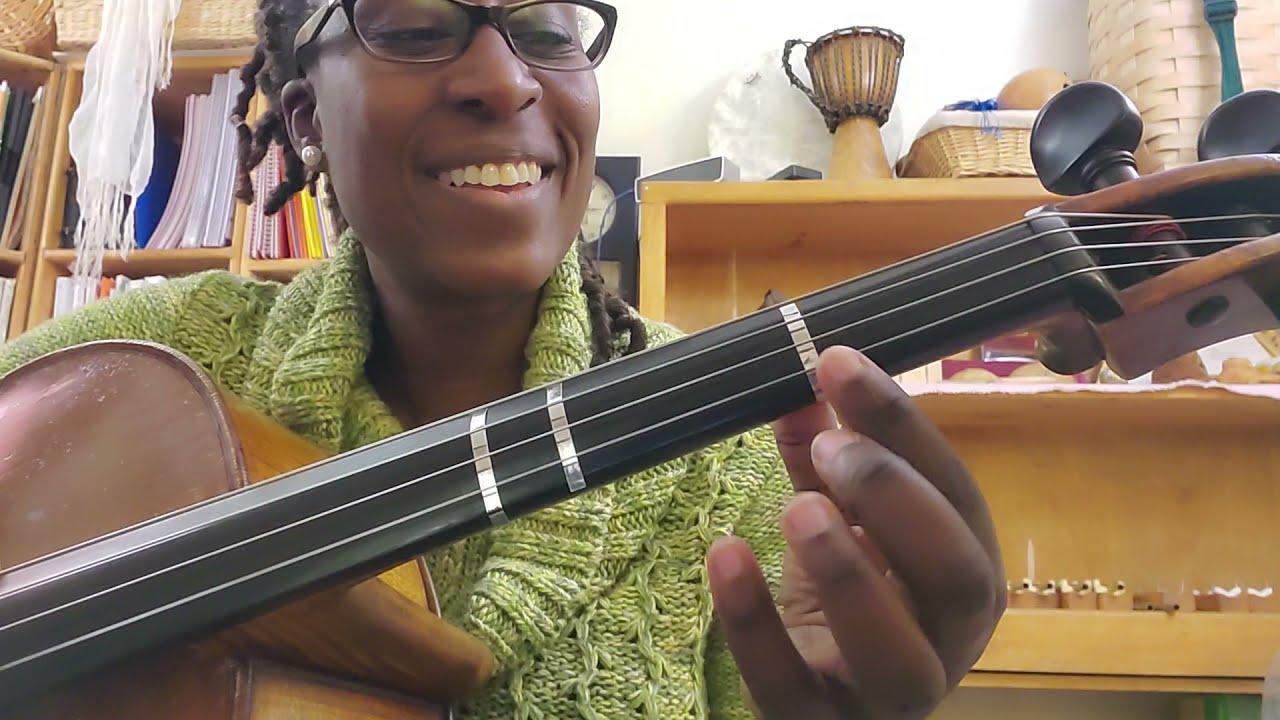 Ms. Smith plays a D major scale for cello