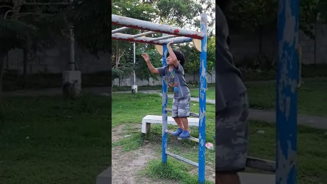 Monkey Bars Challenge Kid at 5 Years Old