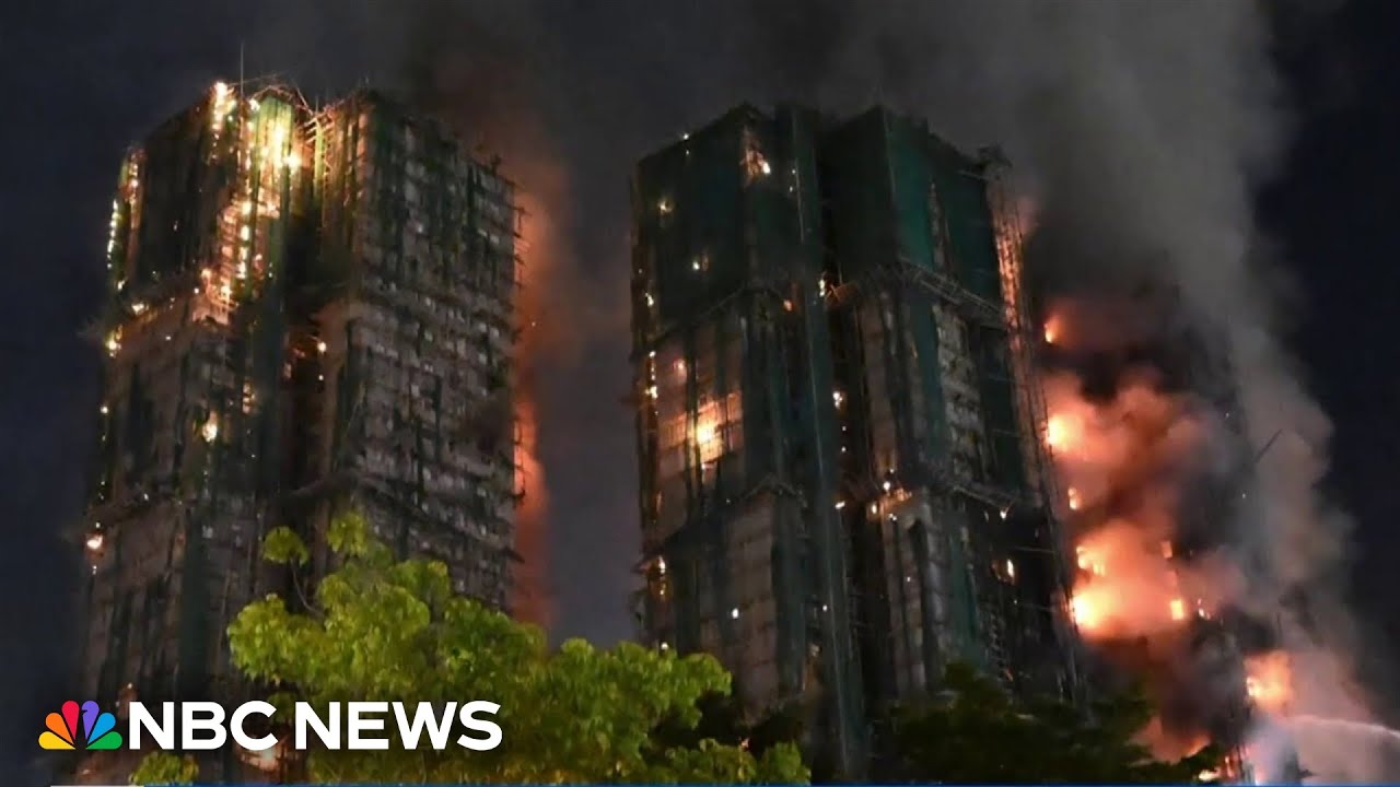 Firefighters unable to search Hong Kong high-rise apartment as fire burns for hours