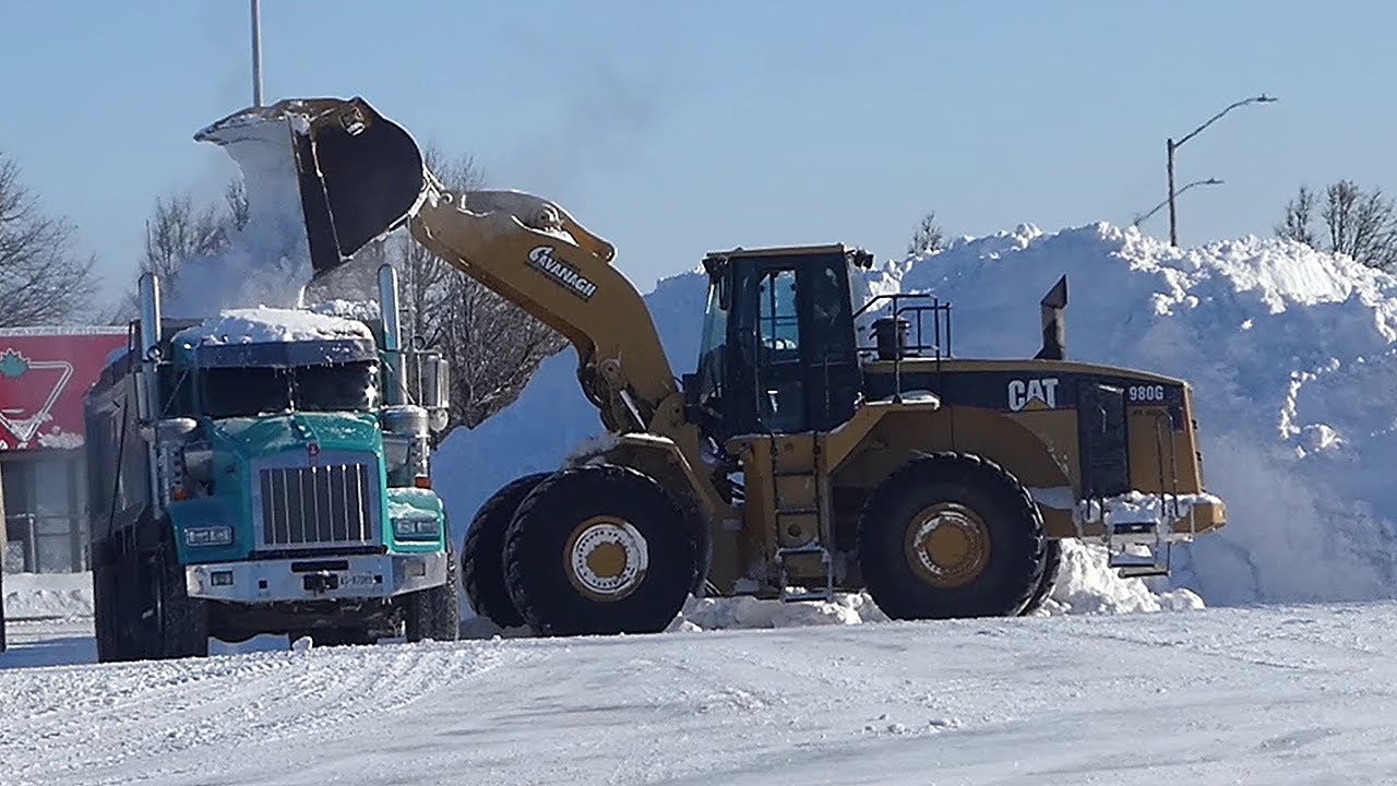 SNOW REMOVAL;  Kenworth dump truck, Cat 980g, Cat 380 Loaders.