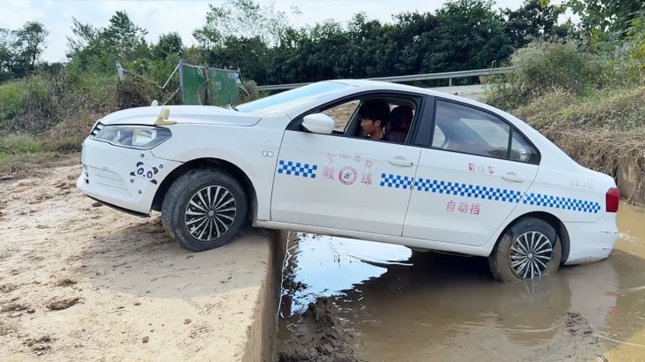 The Car Got Stuck In The Mud, But The Experienced Driver Managed To Drive It Out.