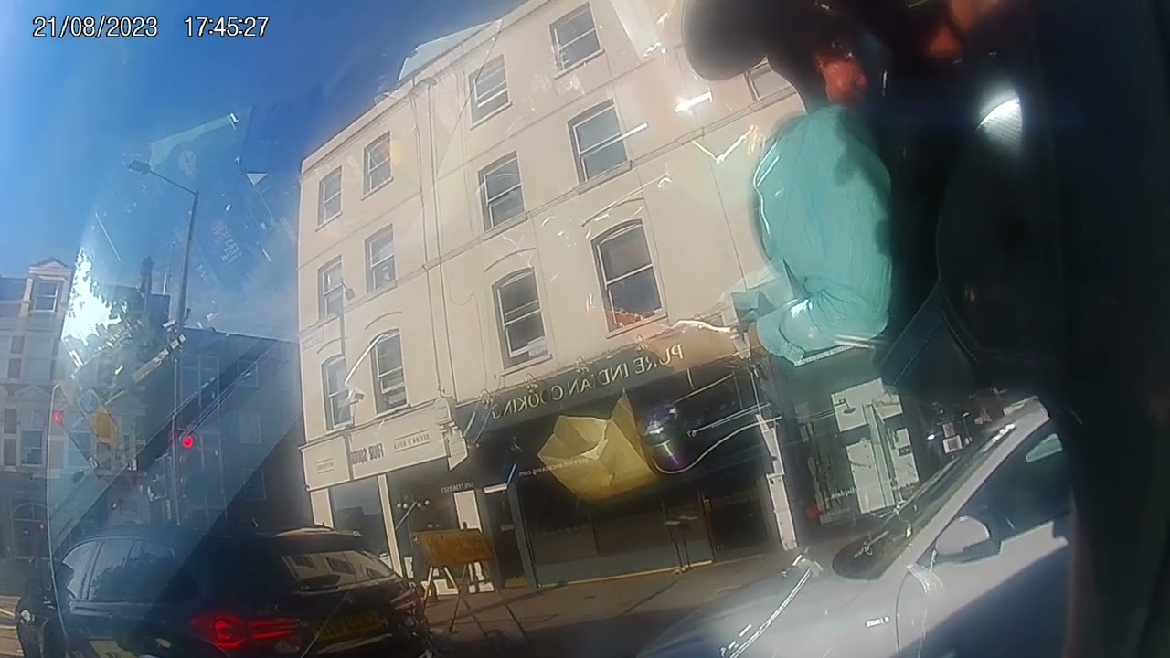 T11 DOM driver using mobile phone Fulham Aug 2023