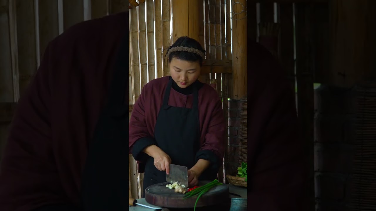The Preserved Mustard Greens Braised Yellow Girl features tender fish meat wrapped in the