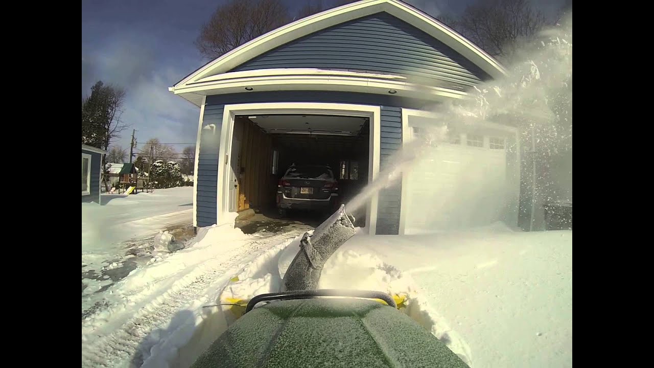 John Deere x500 blowing snow
