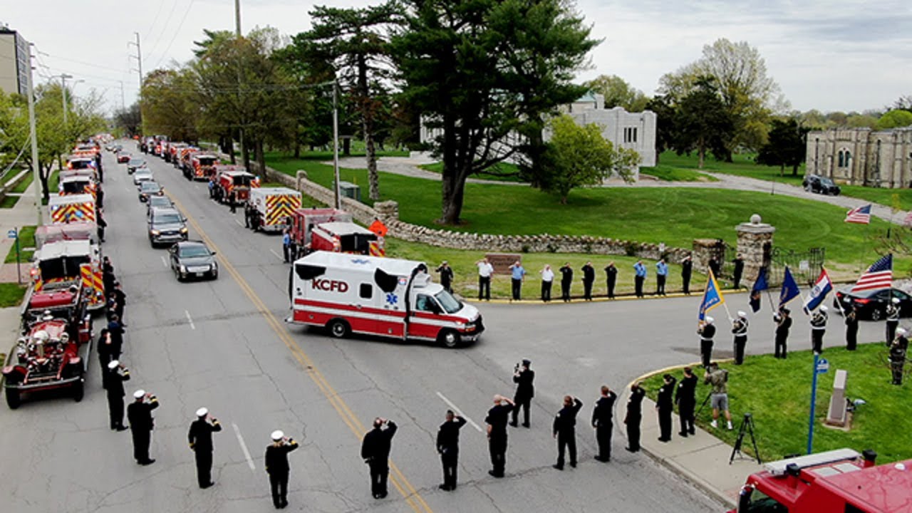 Emergency vehicles lined street for KCFD EMT Billy Birmingham's funeral procession