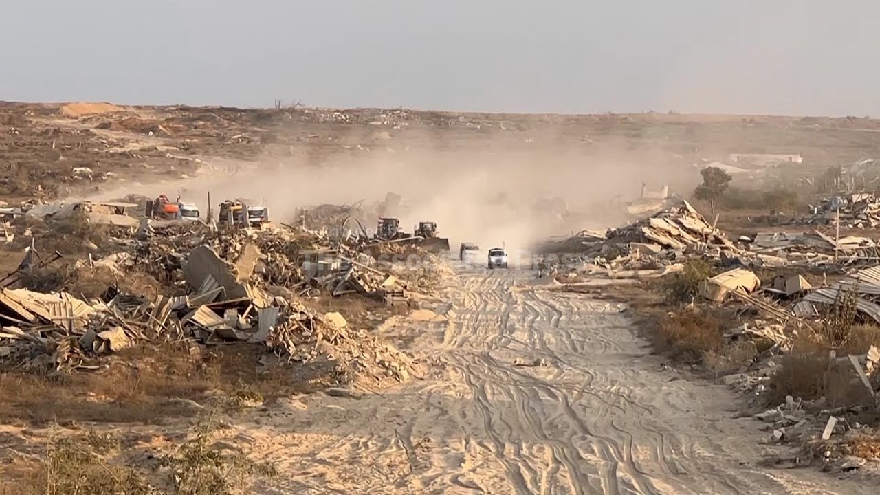 Red Cross and other vehicles leave after what's believed to be search for bodies in Gaza