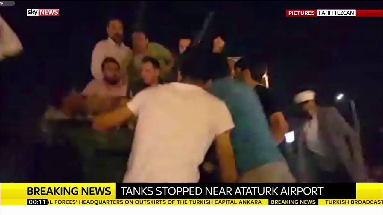 Turkey Protesters Climb Onto Tank Near Istanbul's Ataturk Airport