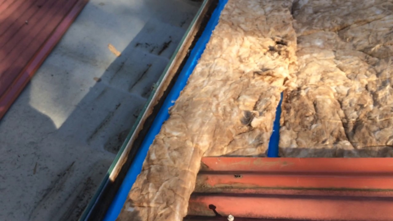 Comfort Zone Installing Earthwool blanket under iron roof to meet current BAL council requirement