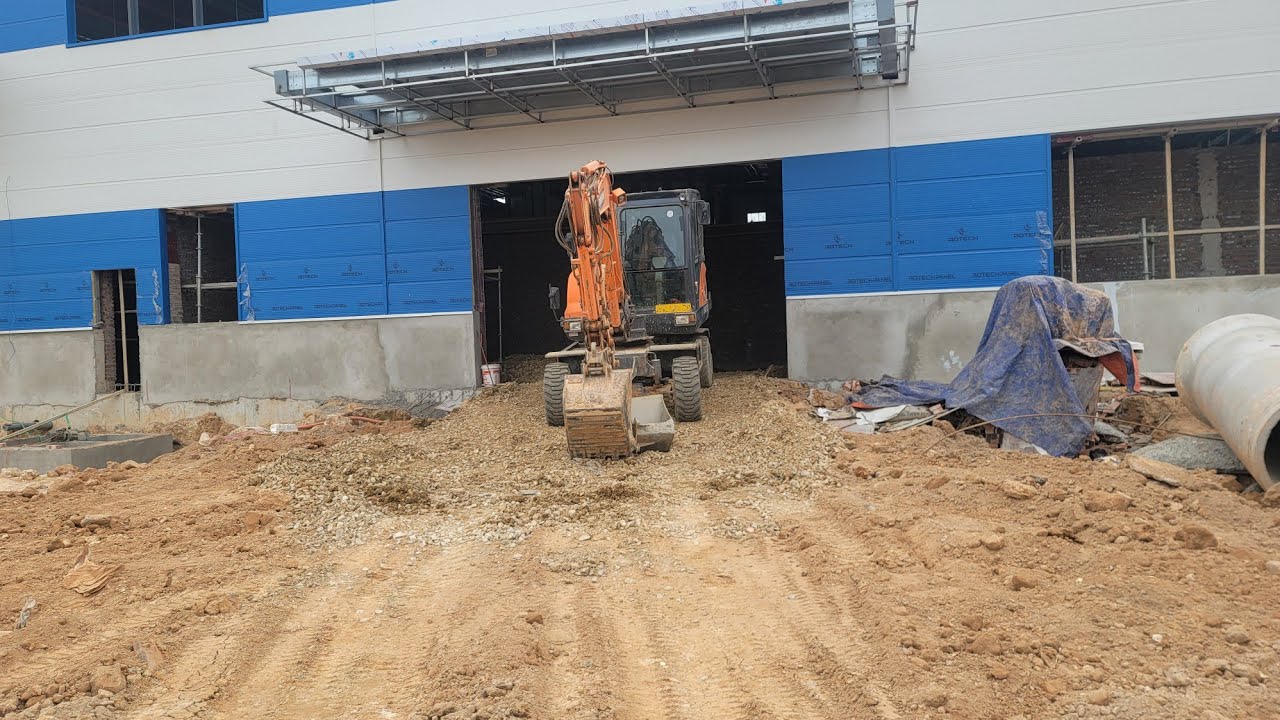 Review góc quay video máy xúc máy đào doosan bánh lốp, excavator Múc đất làm đường để vào móng nhà