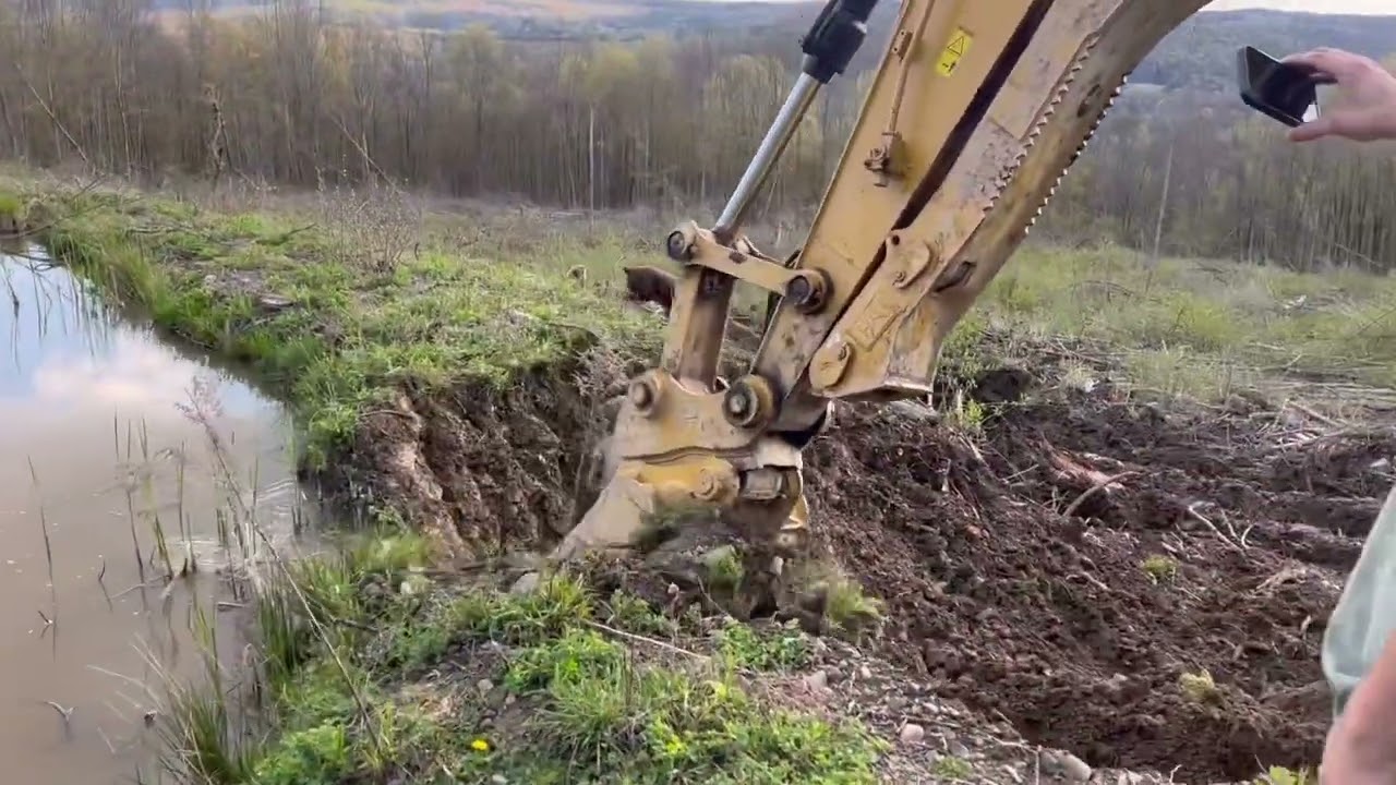 Digging draining out a pond with the CAT316 excavator