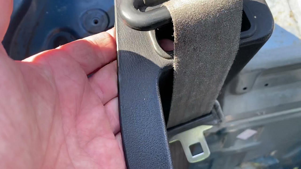 Seatbelt mechanism removal for 1990-1997 Mazda MX-5 Miata.