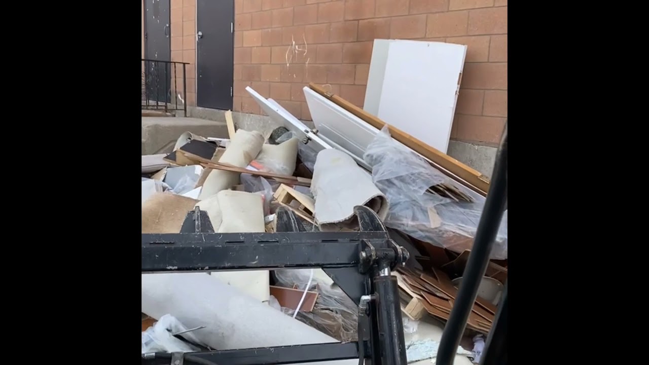40 yards of construction waste cleanup With skid steer and grapple bucket