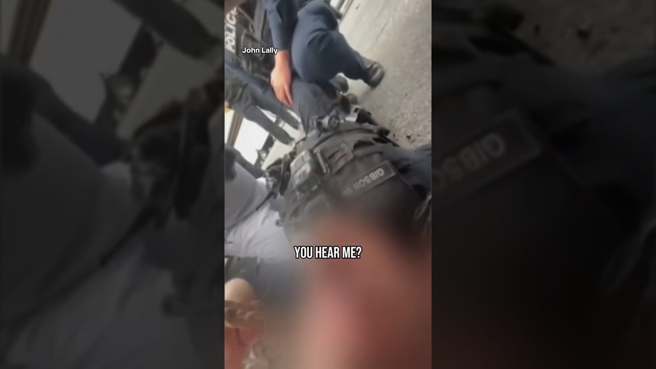 Video shows good Samaritan rescuing police officer amid shootout #shorts