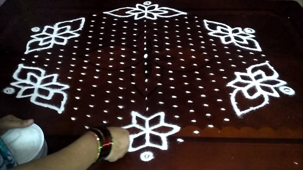 Beautiful Flowers and Shanque Rangoli Designs with 21x11 middle for sankranthi muggulu