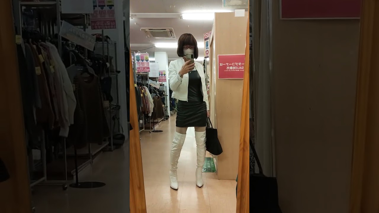 hikaru281 Tight black leather dress under a white jacket and knee high boots