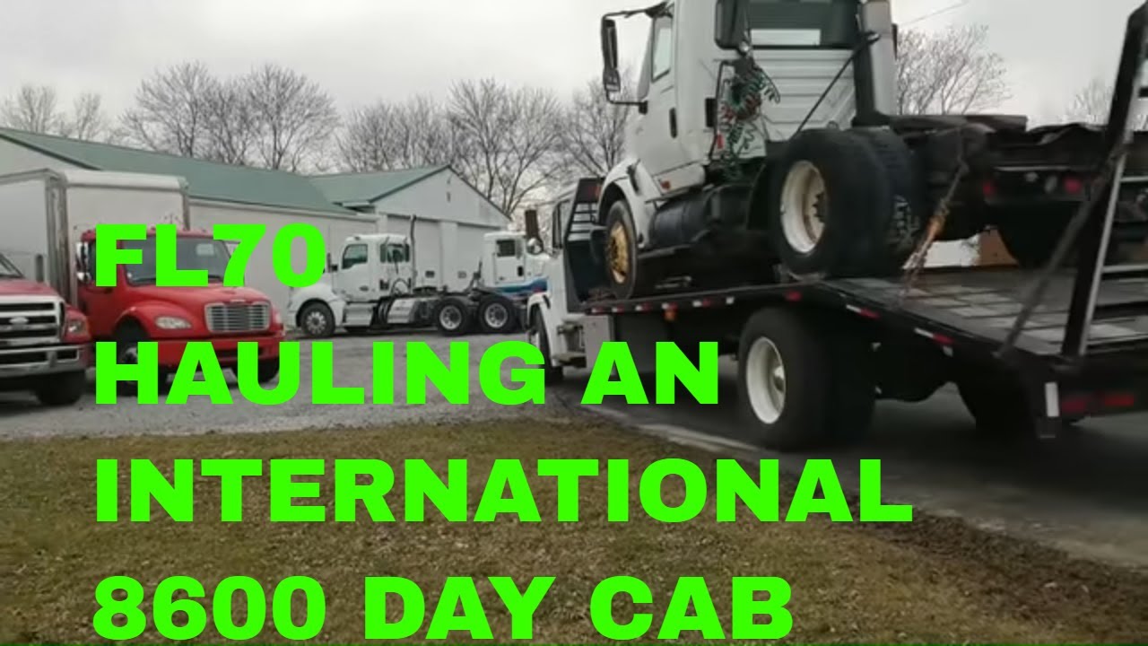 CUMMINS ISM PT3 PICKING UP A PARTS TRUCK....HAULING IH 8600 ON MY FL70.