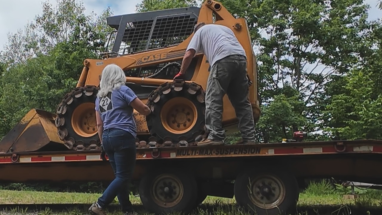 Brand new trailer tires explode  transporting heavy equipment to property